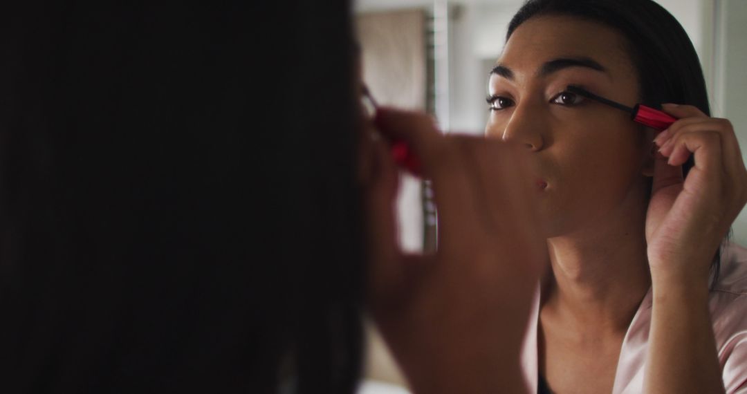 Woman Applying Makeup in Front of Mirror With Focus on Eyes - Free Images, Stock Photos and Pictures on Pikwizard.com