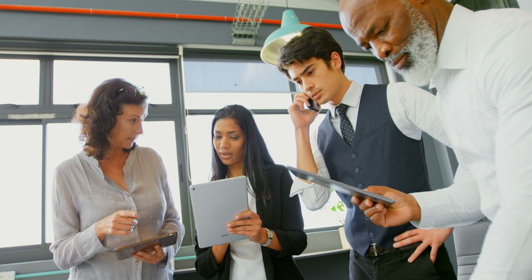 Business Team Reviewing Data Together in Office