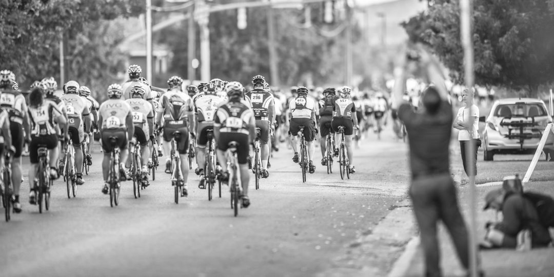 Cyclists Competing in Road Race with Onlookers Cheering - Free Images, Stock Photos and Pictures on Pikwizard.com