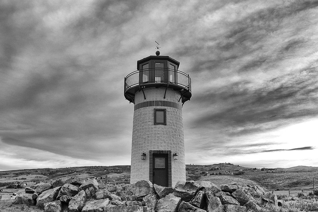 Scenic Lighthouse Overlooking Rugged Landscape