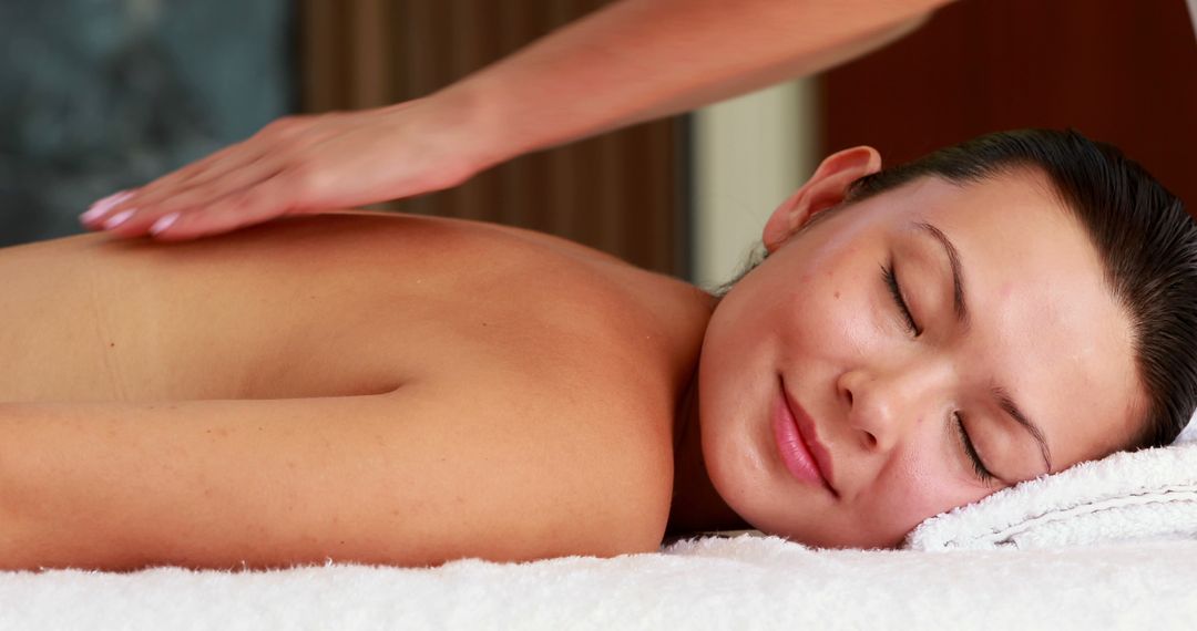 Woman Relaxing During Spa Massage Therapy - Free Images, Stock Photos and Pictures on Pikwizard.com