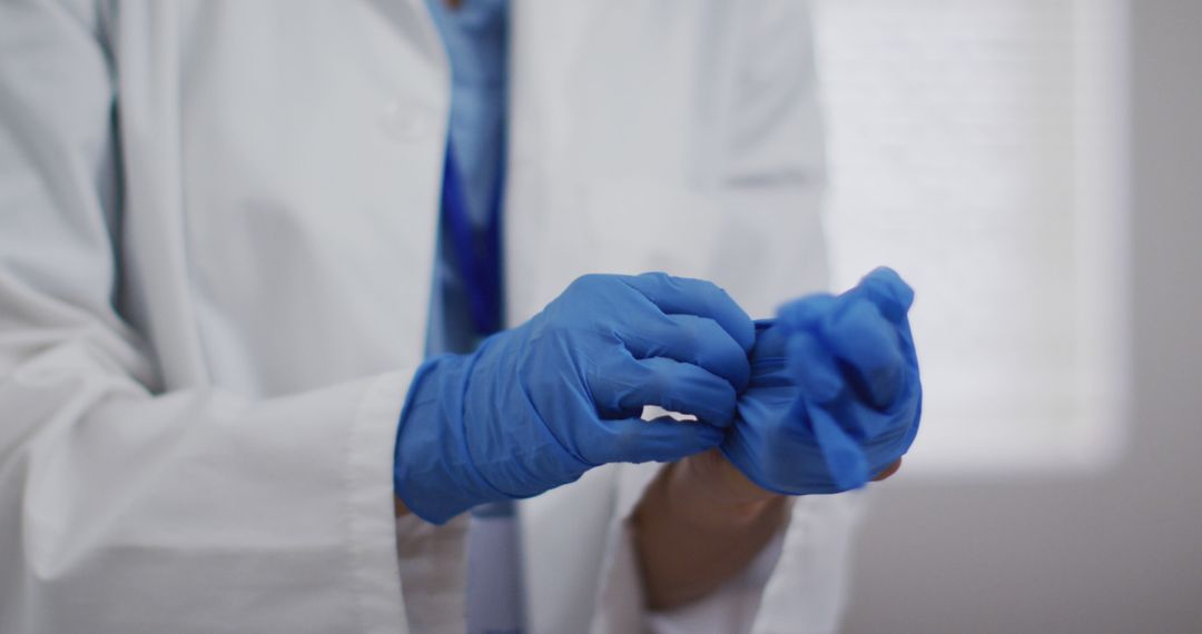 Close-Up of Medical Professional Wearing Blue Gloves - Free Images, Stock Photos and Pictures on Pikwizard.com