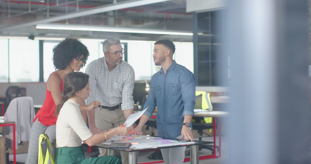 Diverse Architect Team Strategizing in Modern Office