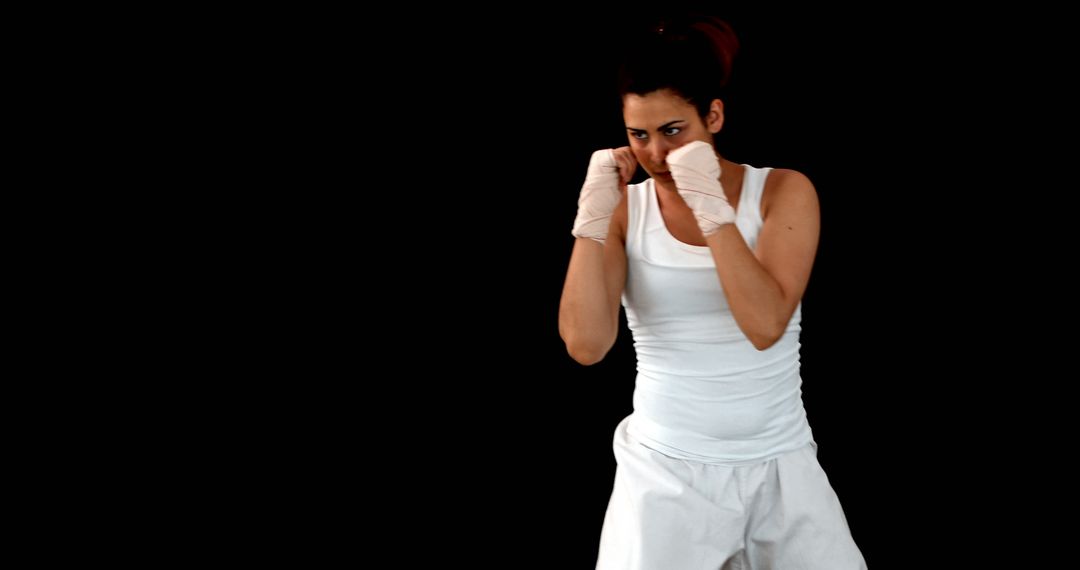 Determined Female Boxer in Defensive Stance - Free Images, Stock Photos and Pictures on Pikwizard.com