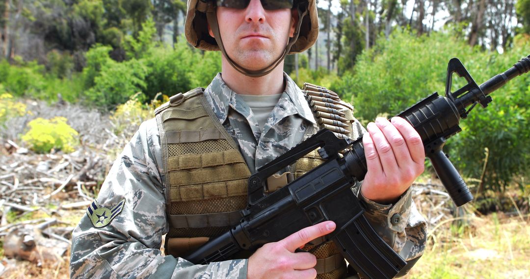 Soldier Holding Rifle Outdoors in Tactical Gear - Free Images, Stock Photos and Pictures on Pikwizard.com