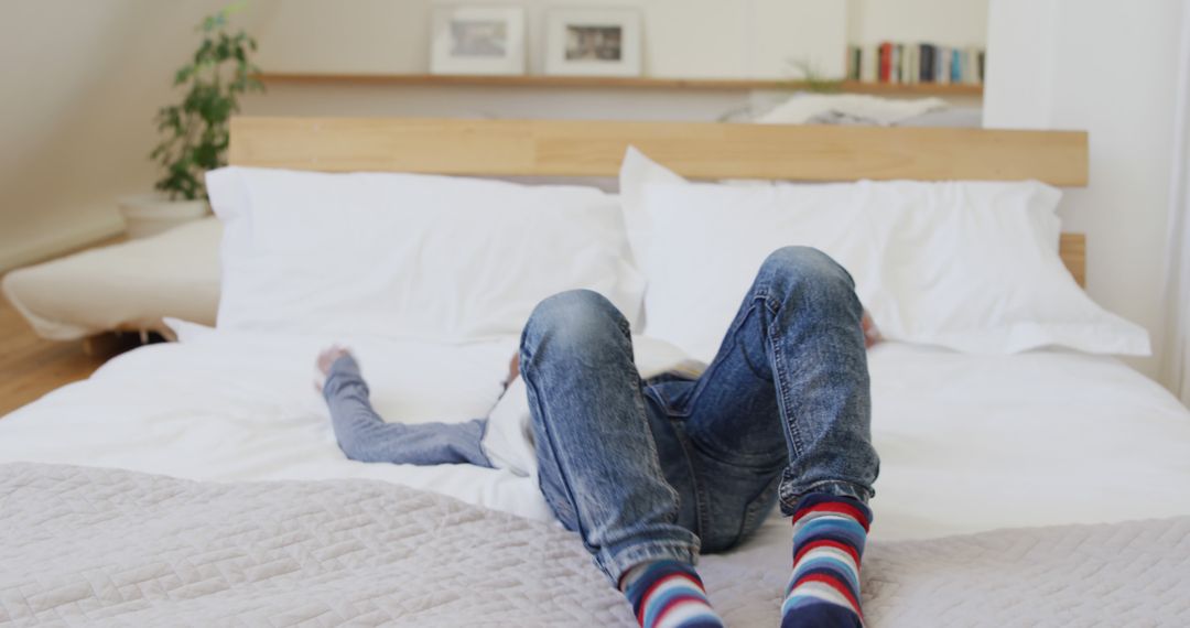 Child Relaxing on Bed in Cozy Bedroom - Free Images, Stock Photos and Pictures on Pikwizard.com