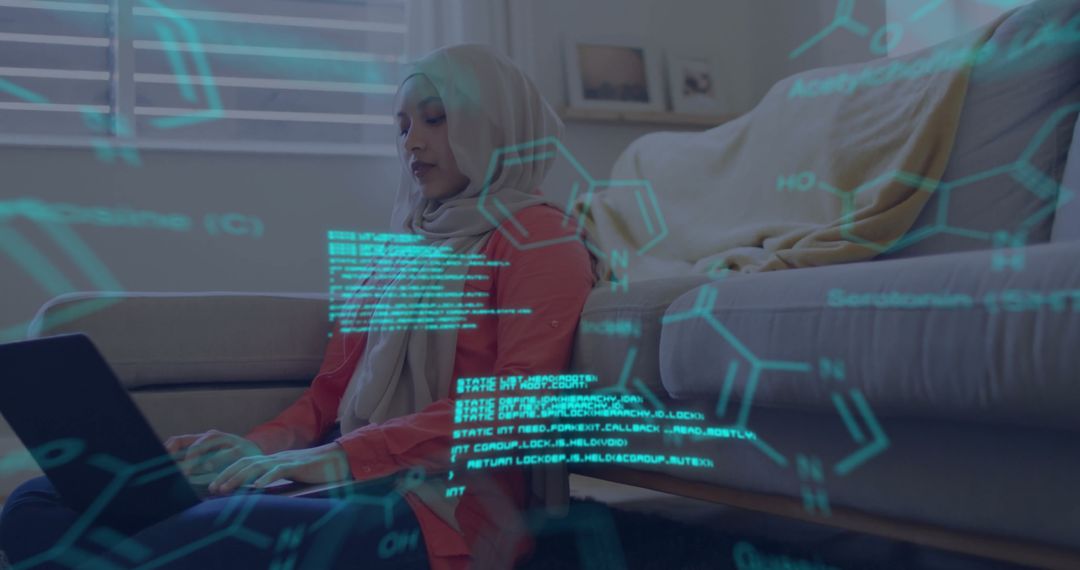 Hijabi Woman Engages in Scientific Data Processing with Laptop at Home