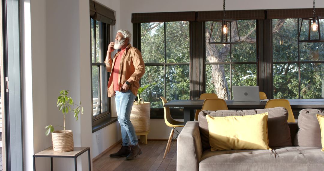 Senior Man Relaxing at Home Balancing Work and Comfort