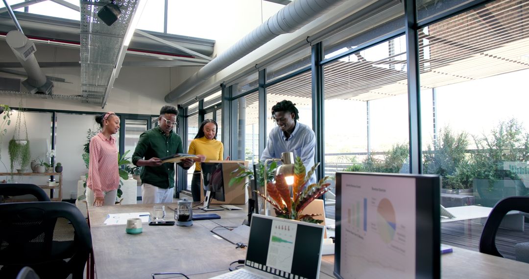 Successful Team Celebrating in Modern Office