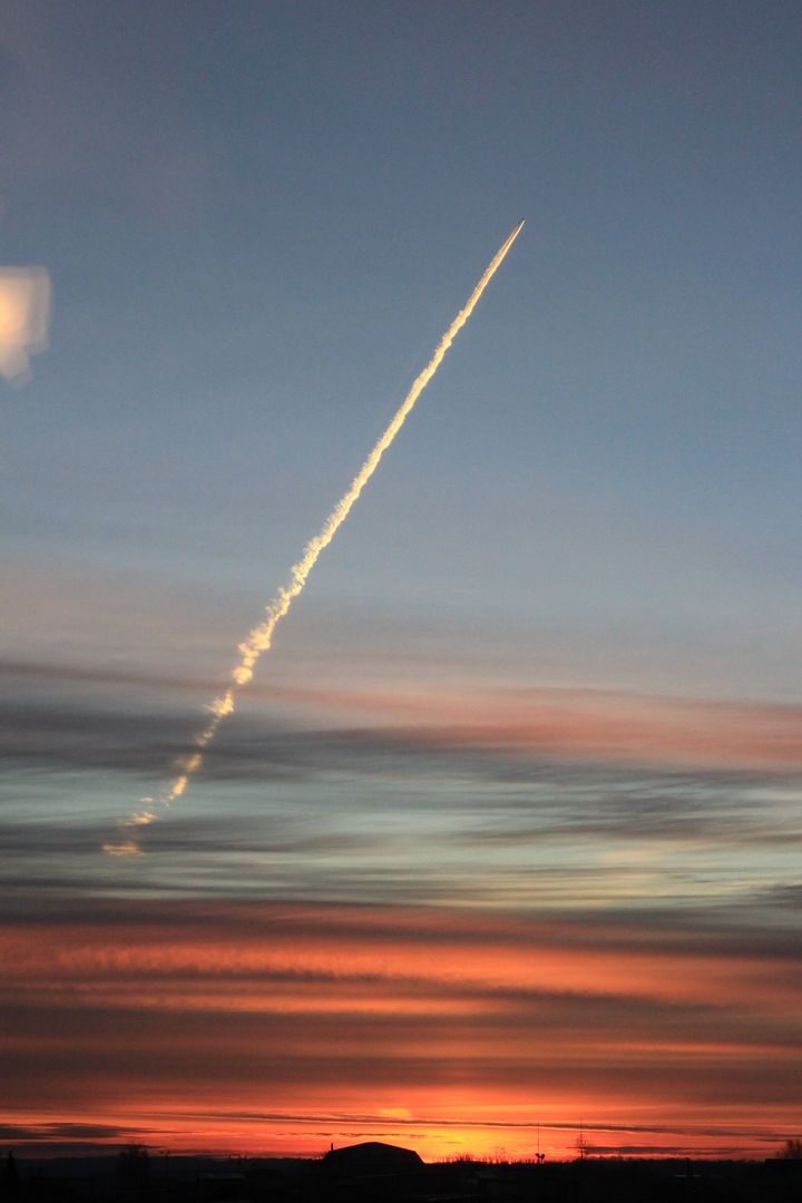 Rocket Launching into Vibrant Sunset Sky with Streaking Trail - Free Images, Stock Photos and Pictures on Pikwizard.com