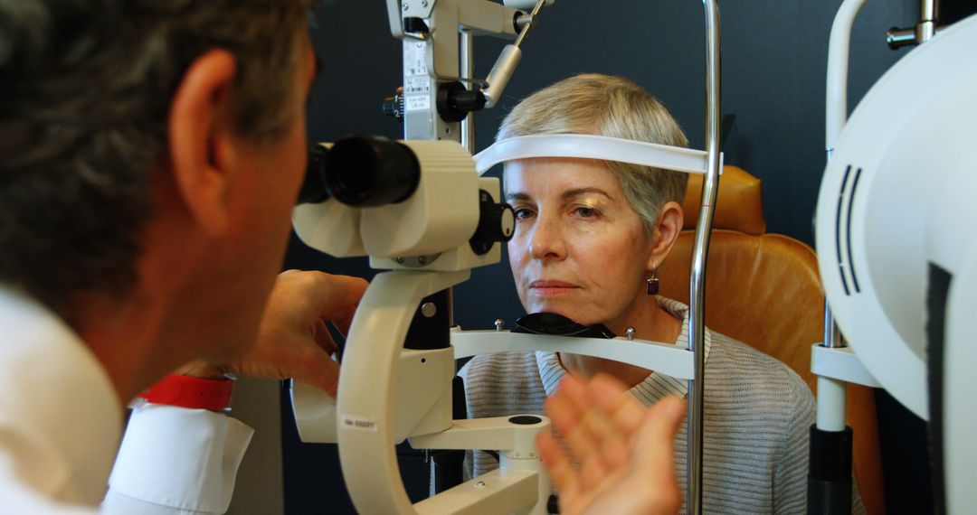 Senior Woman Undergoing Eye Exam with Optometrist - Free Images, Stock Photos and Pictures on Pikwizard.com