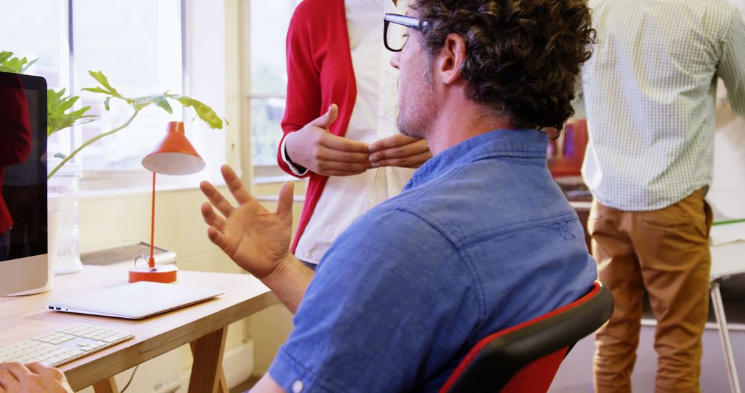 Business Colleagues Discussing Projects in Modern Office