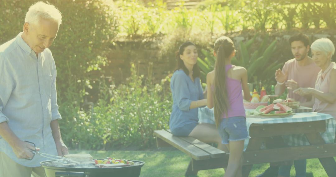 Family Enjoying Barbecue Picnic Time in Garden