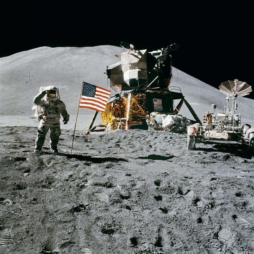 Astronaut Standing Beside American Flag on the Moon - Free Images, Stock Photos and Pictures on Pikwizard.com