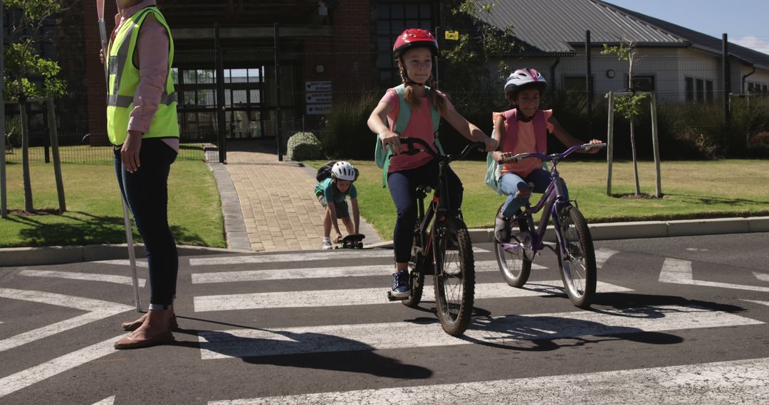 Group of Children Riding Bicycles and Scootering Across a Pedestrian Crossing - Free Images, Stock Photos and Pictures on Pikwizard.com