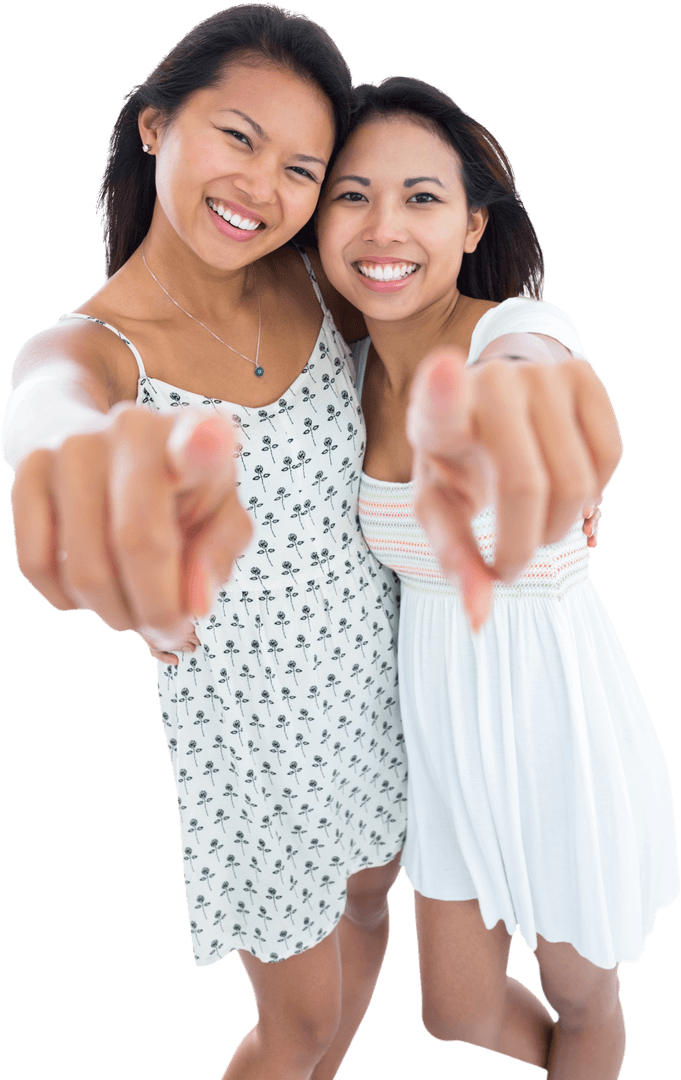 Laughing Sisters in Transparent Background Pointing at Camera