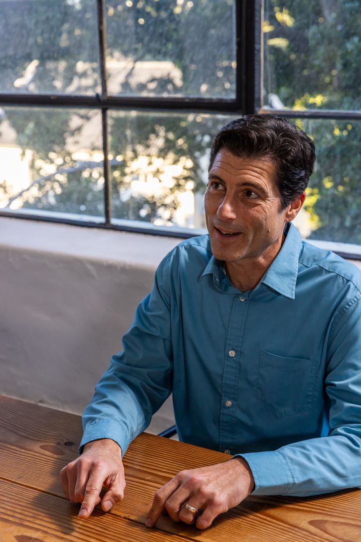 Business Professional Discussing Strategies in Modern Office