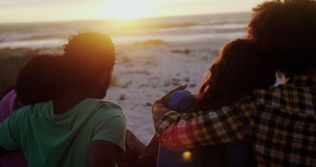 Friends Watching Sunset at Beach in Close Embrace - Free Images, Stock Photos and Pictures on Pikwizard.com