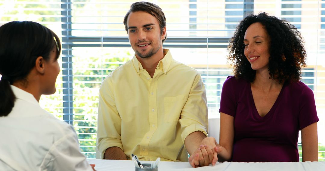 Couple Consulting with Advisor in Bright Office Setting
