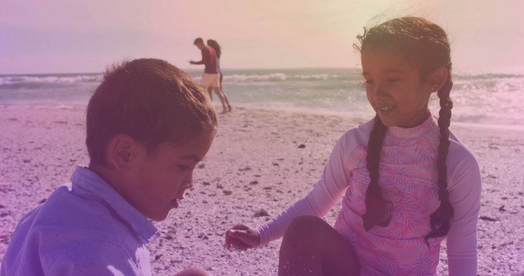 Siblings Enjoying Day at Beach with Joyful Spirits