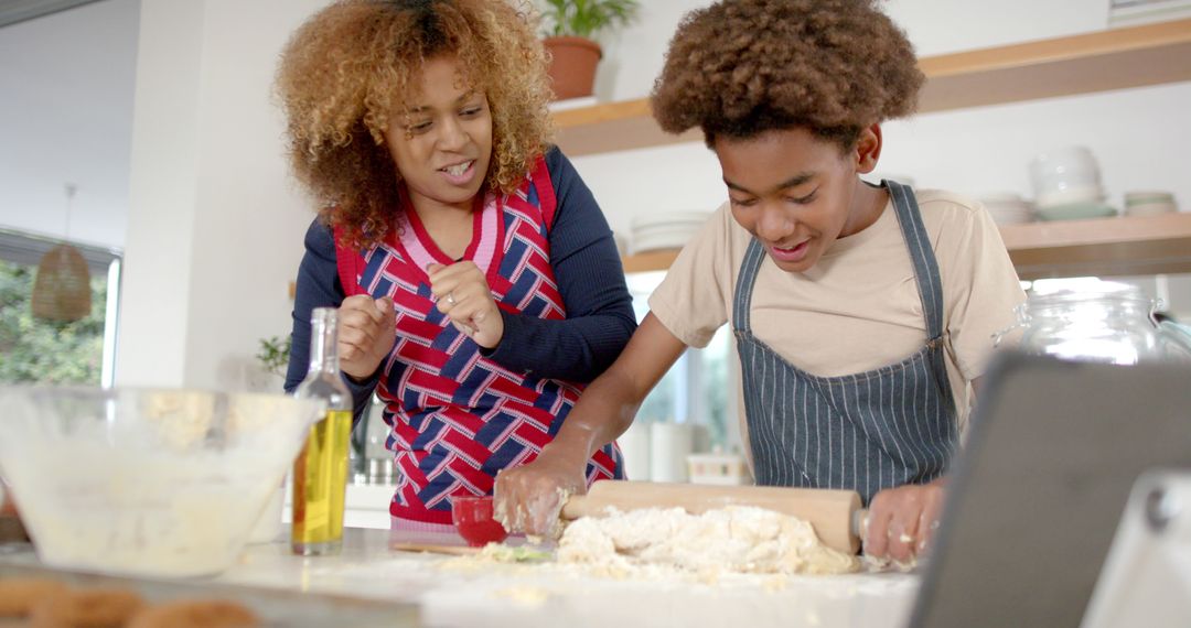 Mother and Son Baking Together in Kitchen with Smiling Faces - Free Images, Stock Photos and Pictures on Pikwizard.com