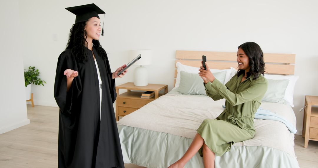Graduate in Cap and Gown Sharing Advice in Home Environment