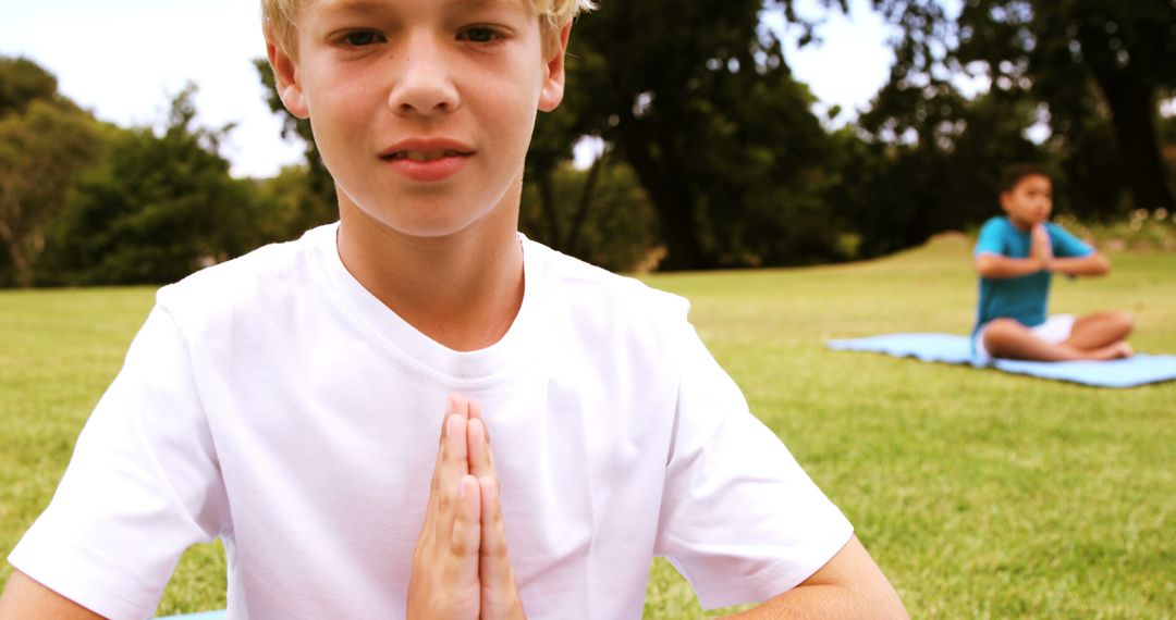 Young Boys Practicing Yoga Outdoors in Park - Free Images, Stock Photos and Pictures on Pikwizard.com