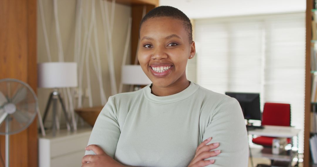 Confident Young African American Woman Smiling at Home Office - Free Images, Stock Photos and Pictures on Pikwizard.com