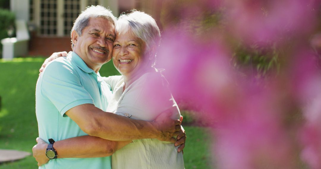 Image of happy biracial senior couple embracing in garden - Free Images, Stock Photos and Pictures on Pikwizard.com