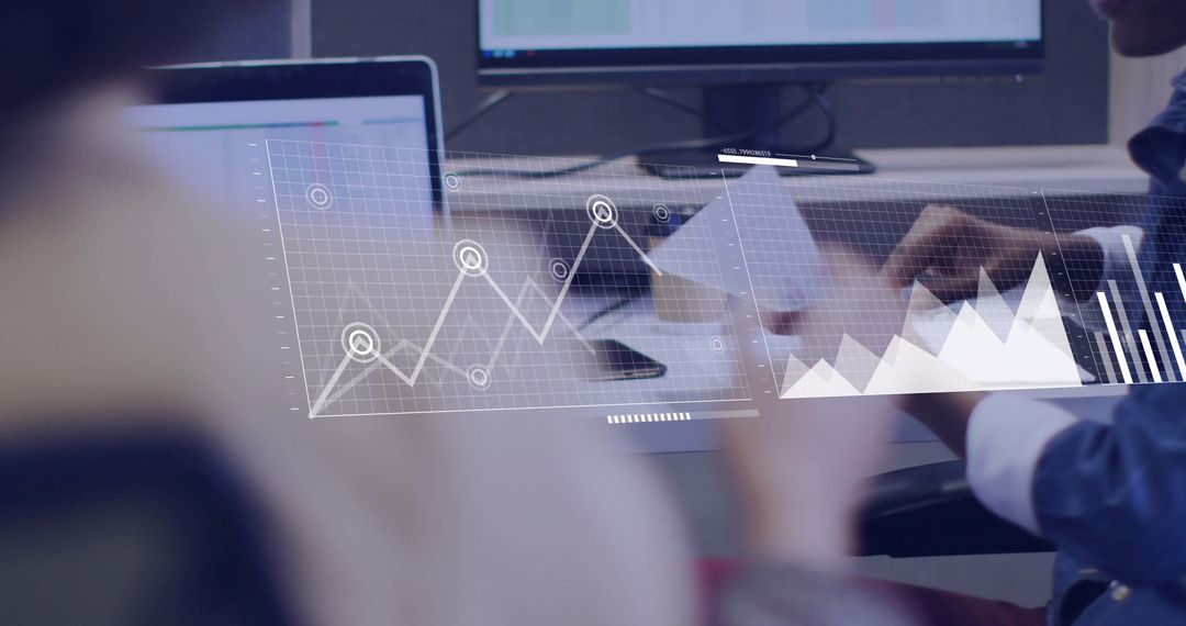 Business Team Analyzing Financial Graphs in Office Environment
