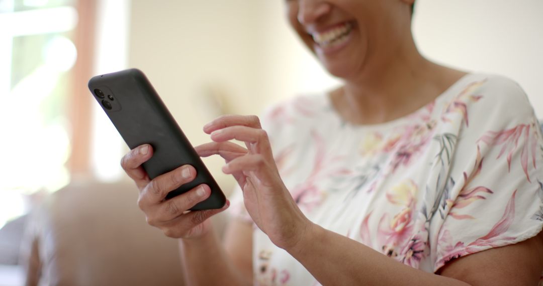 Happy Senior Woman Enjoying Smartphone Communication at Home