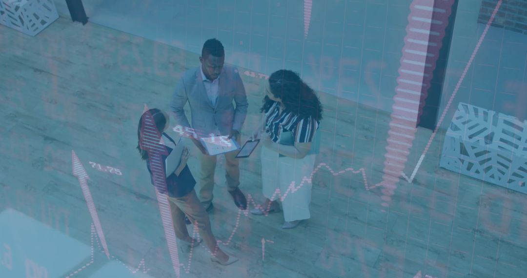 Team of Executives Analyzing Market Data in Office