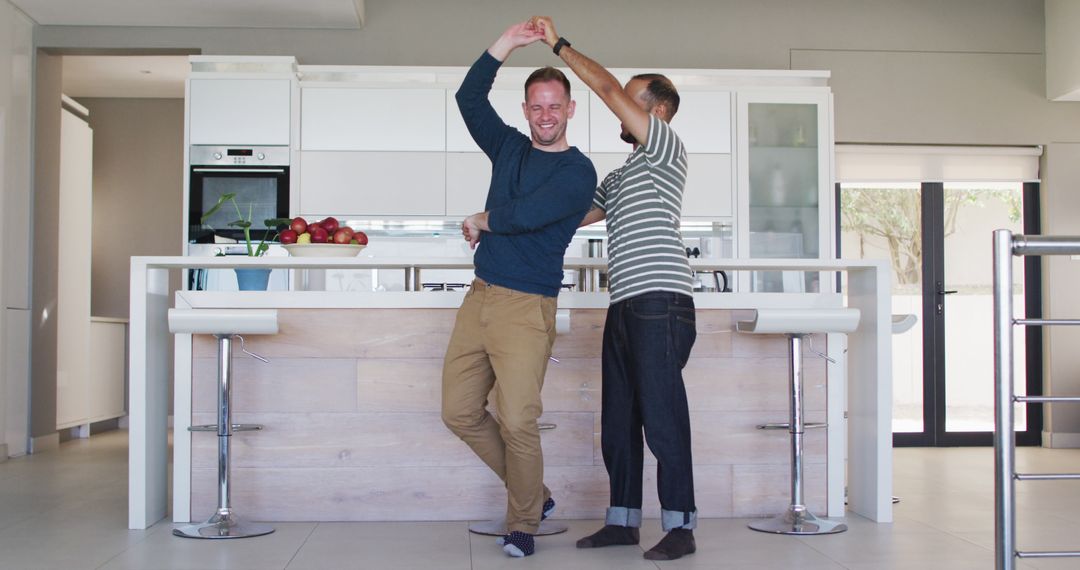 Two Happy Men Dancing in Modern Kitchen - Free Images, Stock Photos and Pictures on Pikwizard.com