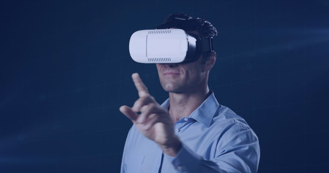 Man Interacting with Virtual Reality Headset in Dark Setting