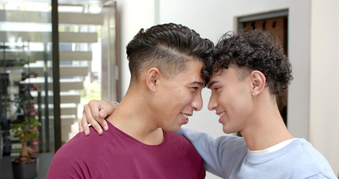 Intimate Moment Between Young Men in Modern Entrance Way
