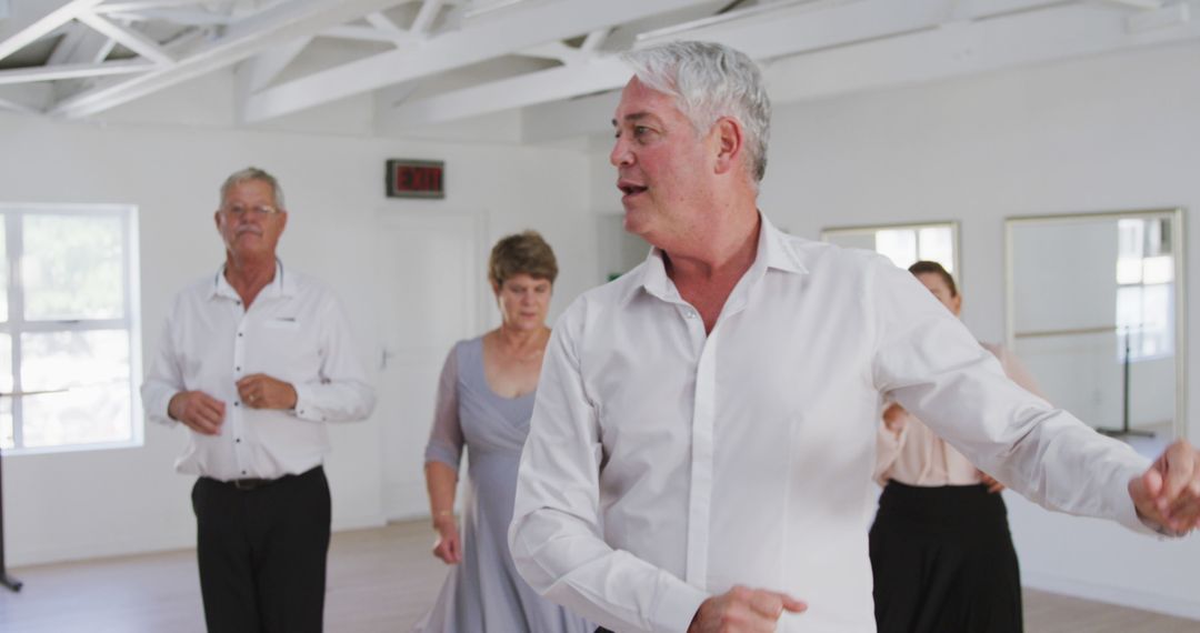 Group of Older Adults Enjoying Dance Class in Modern Studio - Free Images, Stock Photos and Pictures on Pikwizard.com