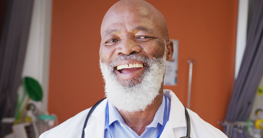 Smiling Elderly African American Doctor with Stethoscope in Medical Office - Free Images, Stock Photos and Pictures on Pikwizard.com