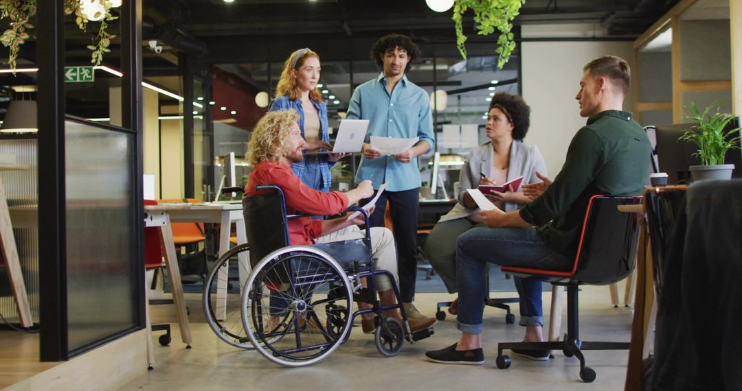 Diverse Team Meeting in Modern Open-Plan Workspace