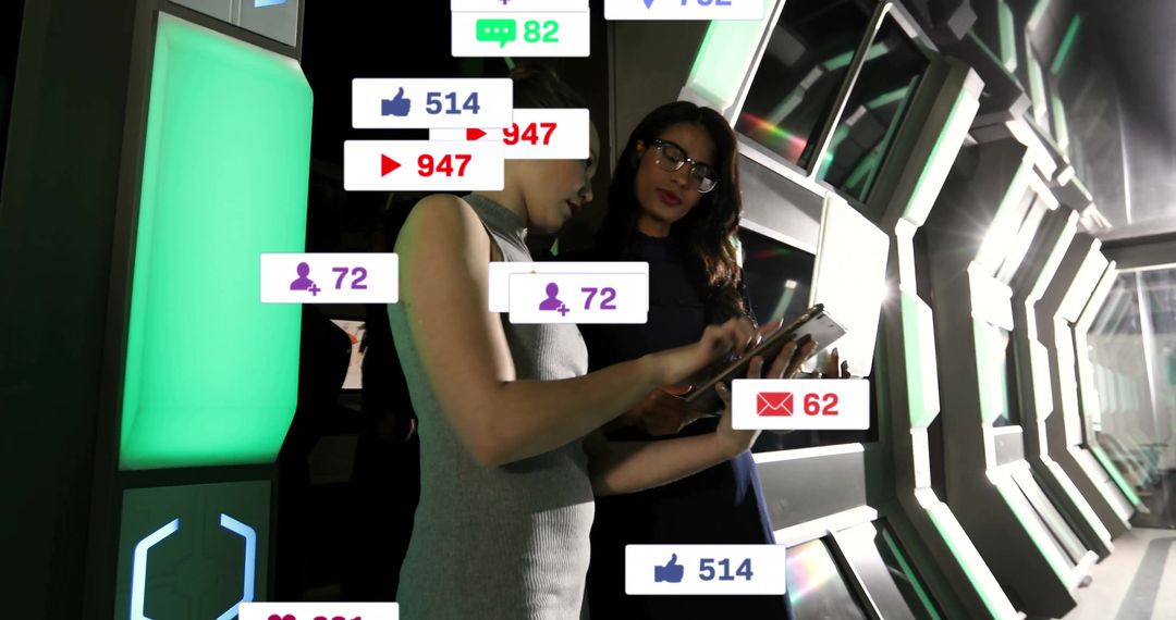 Women Analyzing Social Media Metrics in Futuristic Tech Corridor