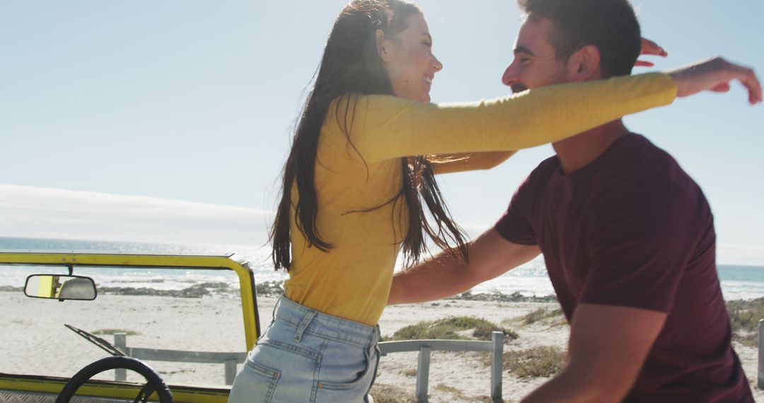 Young Couple Embracing Near Beach - Free Images, Stock Photos and Pictures on Pikwizard.com