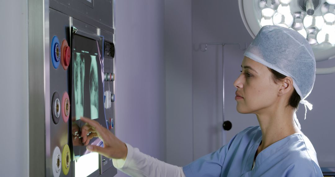 Female Doctor Examining X-Ray Image on Touchscreen in Modern Hospital - Free Images, Stock Photos and Pictures on Pikwizard.com