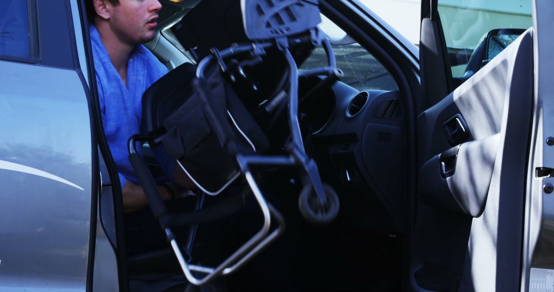 Driver Preparing Wheelchair Pickup from Car Door - Free Images, Stock Photos and Pictures on Pikwizard.com