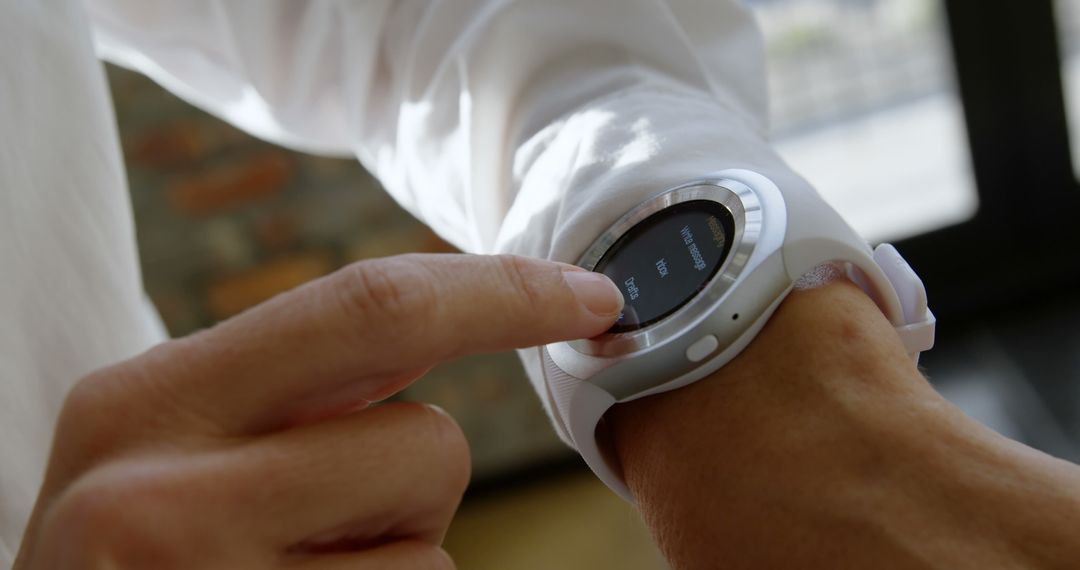 Close-Up of Person Using Smartwatch with Touchscreen Functionality - Free Images, Stock Photos and Pictures on Pikwizard.com