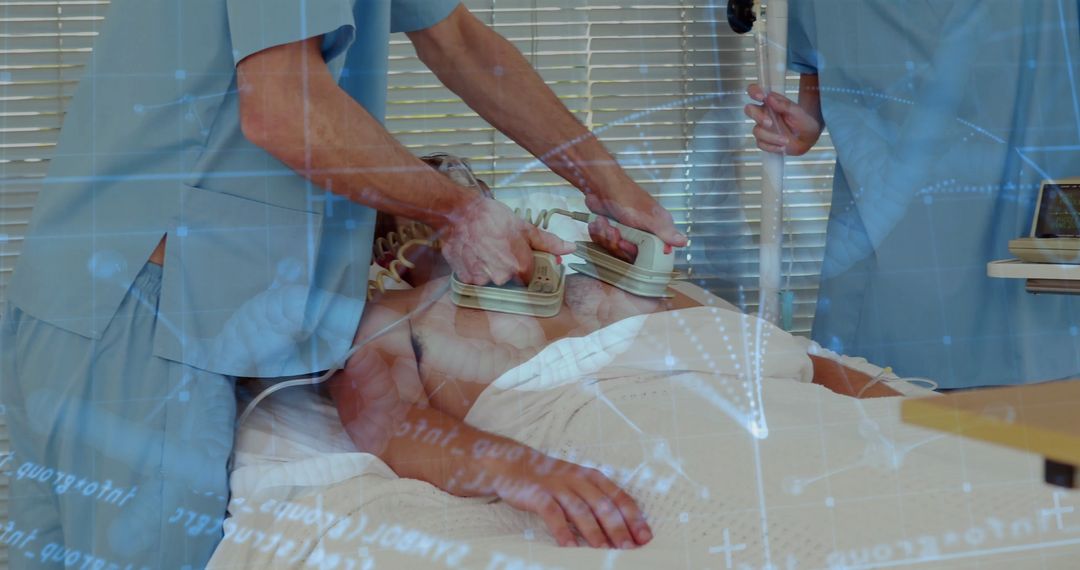 Medical Team Using Defibrillator for Patient Emergency Intervention