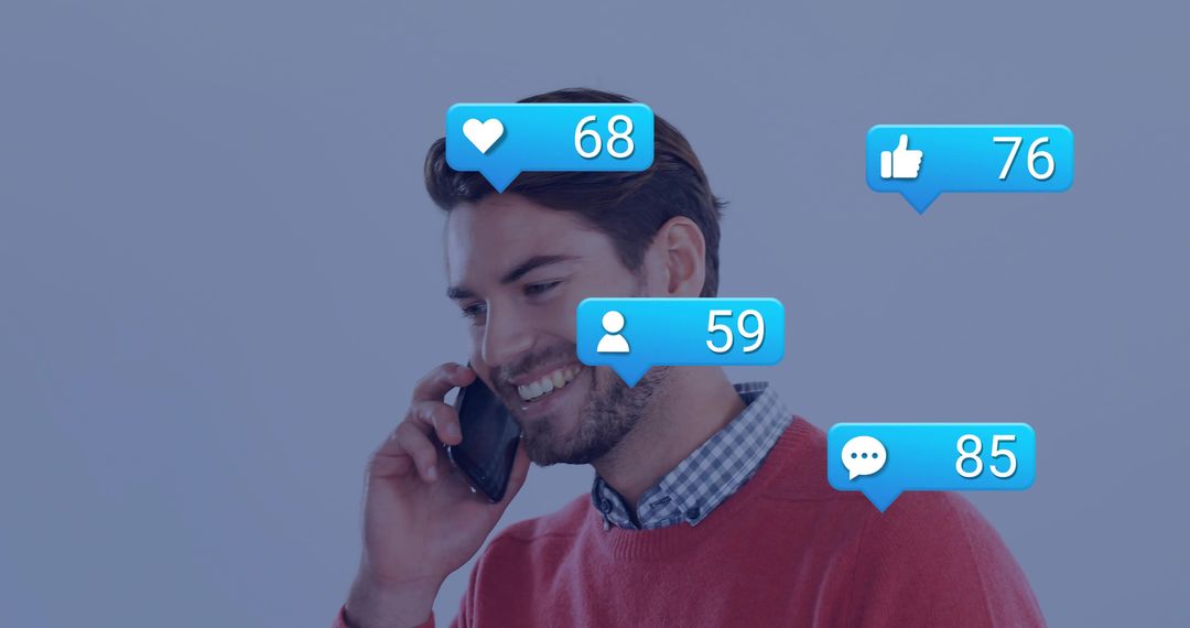 Young man holding smartphone smiling with social media notifications showing likes followers comment