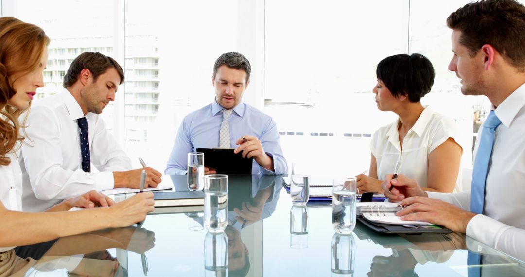 Business Team Having Discussion at Conference Table - Free Images, Stock Photos and Pictures on Pikwizard.com