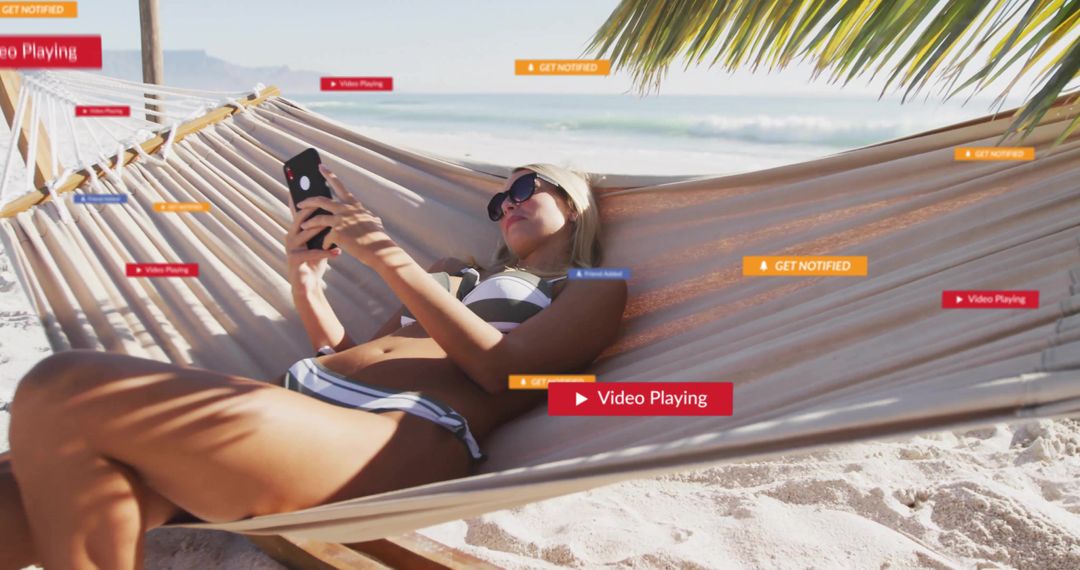 Relaxed Woman Browsing Smartphone in Hammock at Tropical Beach
