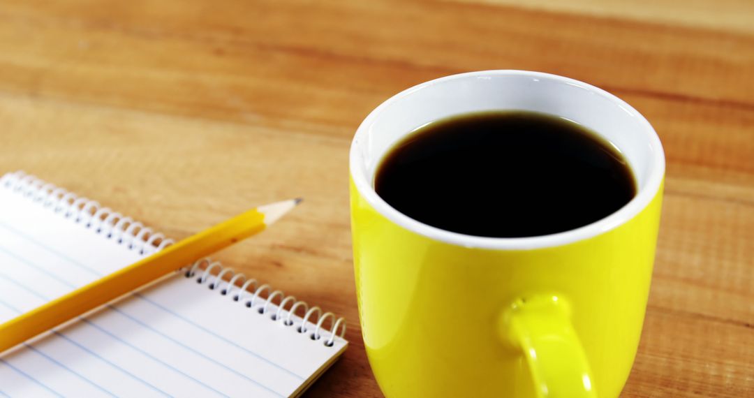 Cup of Coffee with Notepad and Pencil on Wooden Table - Free Images, Stock Photos and Pictures on Pikwizard.com