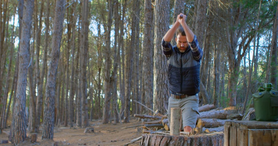 Man Chopping Wood in Forest for Camping Preparation - Free Images, Stock Photos and Pictures on Pikwizard.com