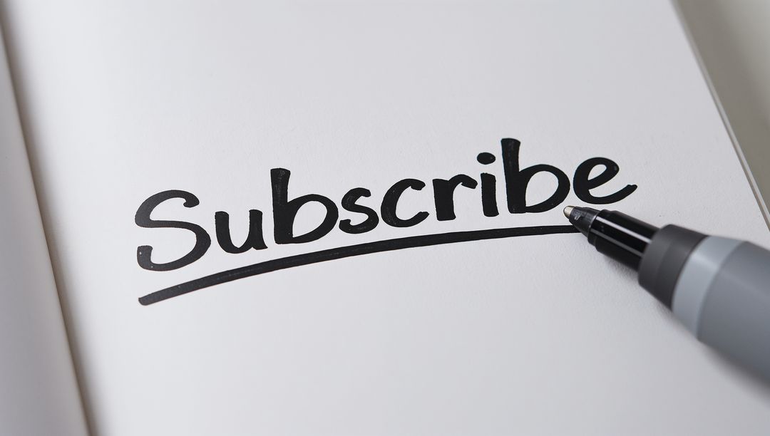 Writing Subscribe Lettering with Black Marker and Underline on White Page Close-up Minimal